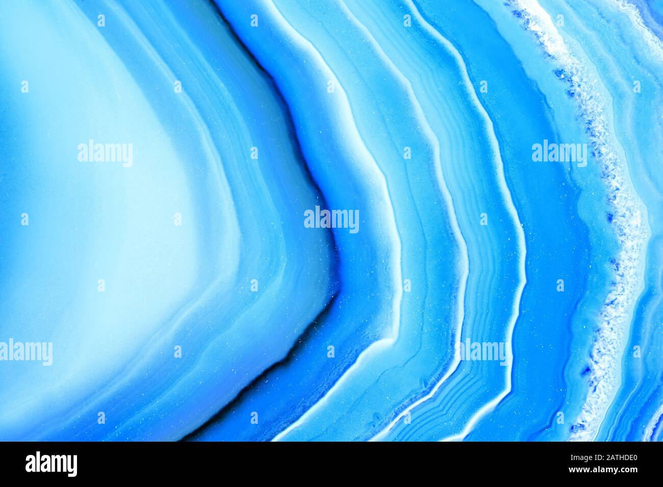 Closeup of blue banded agate mineral stone, pattern background with details of mineralogy Stock Photo