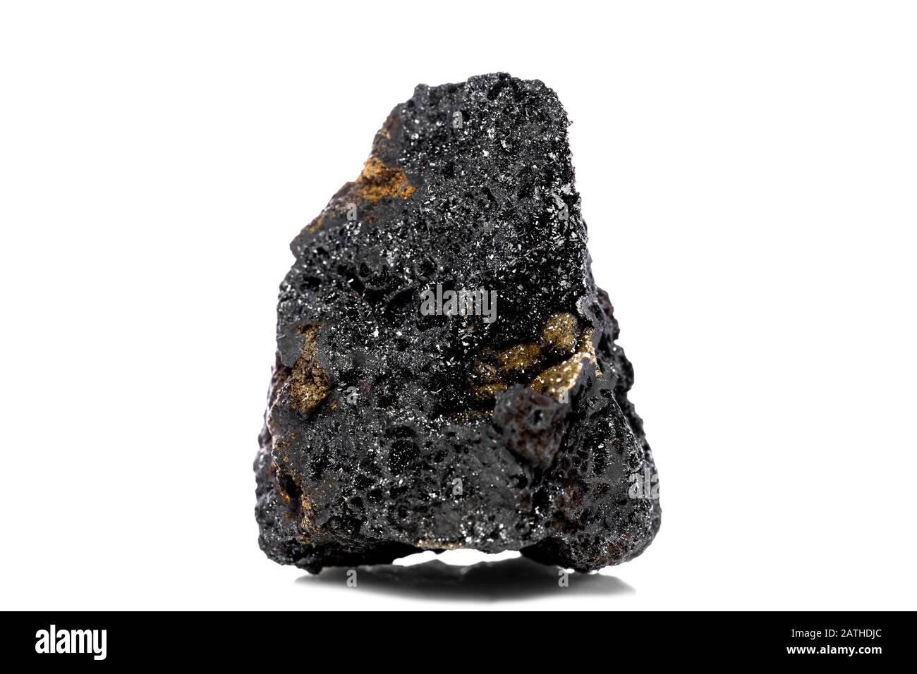 Raw and unrefined manganese ore in front of white isolated background, geology and mining Stock Photo