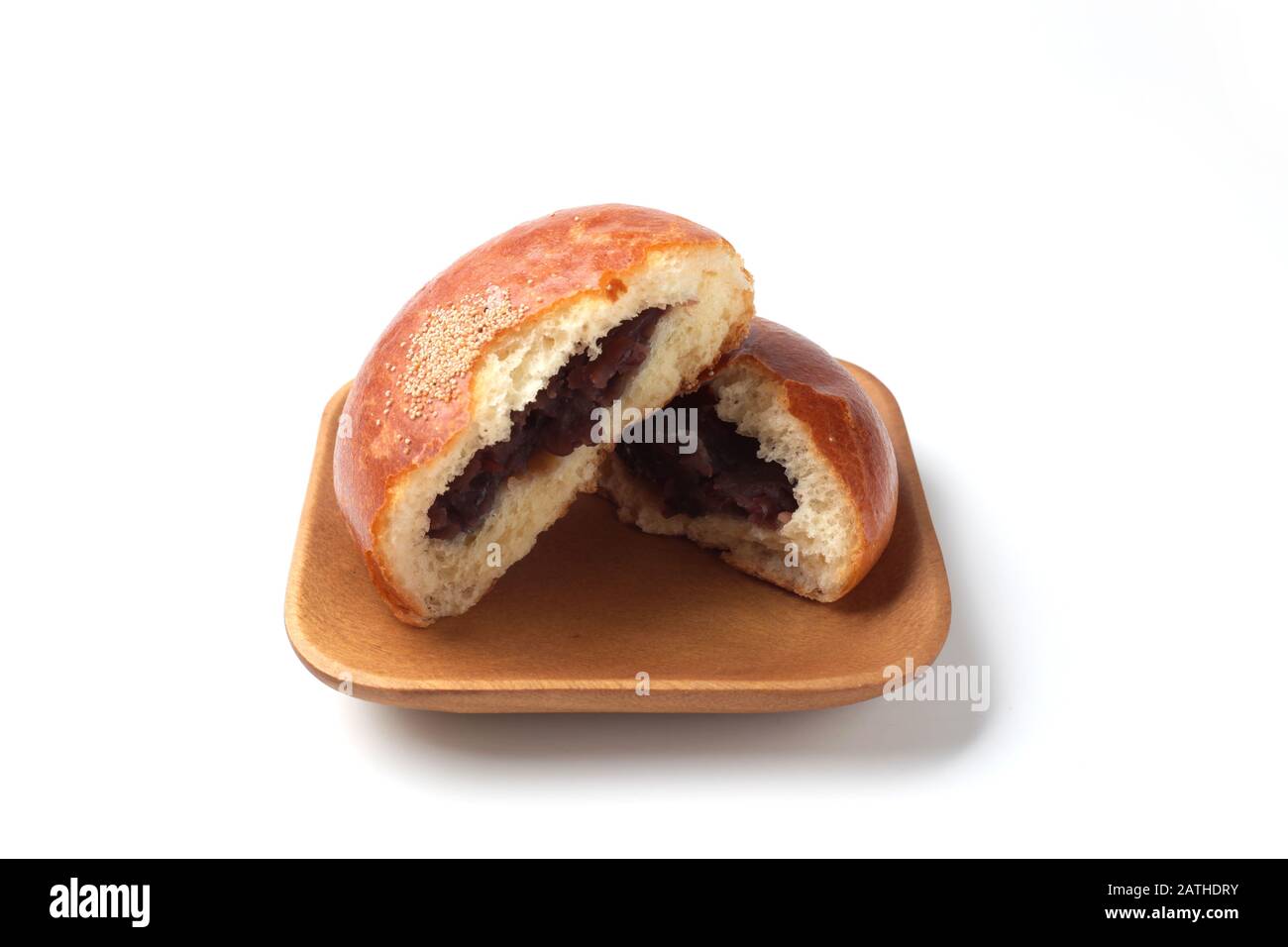 anpan round bread with azuki red beans paste closeup isolated on plate ...