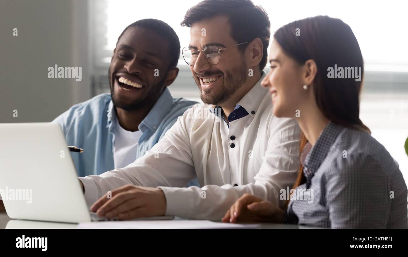 Three multi-ethnic colleagues watching funny prank videos at workplace Stock Photo - Alamy Three multi-ethnic colleagues watching funny prank videos at workplace Stock Photo - Alamy