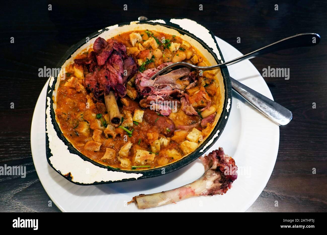 Cassoulet, a rustic French duck stew with beans, sausage, and veggies Stock Photo