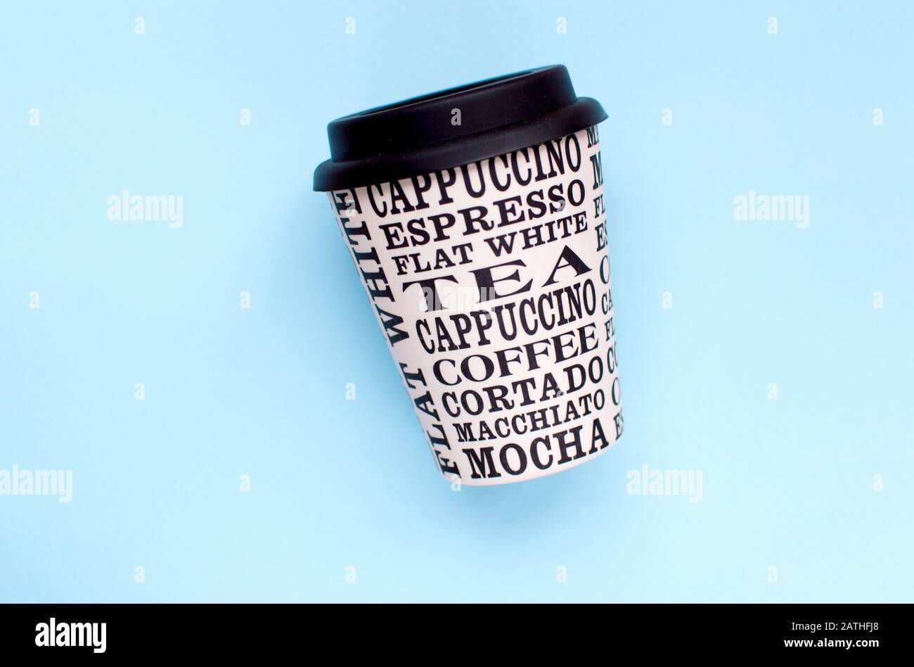 Coffee cup reusable made from plants on a green background Stock Photo