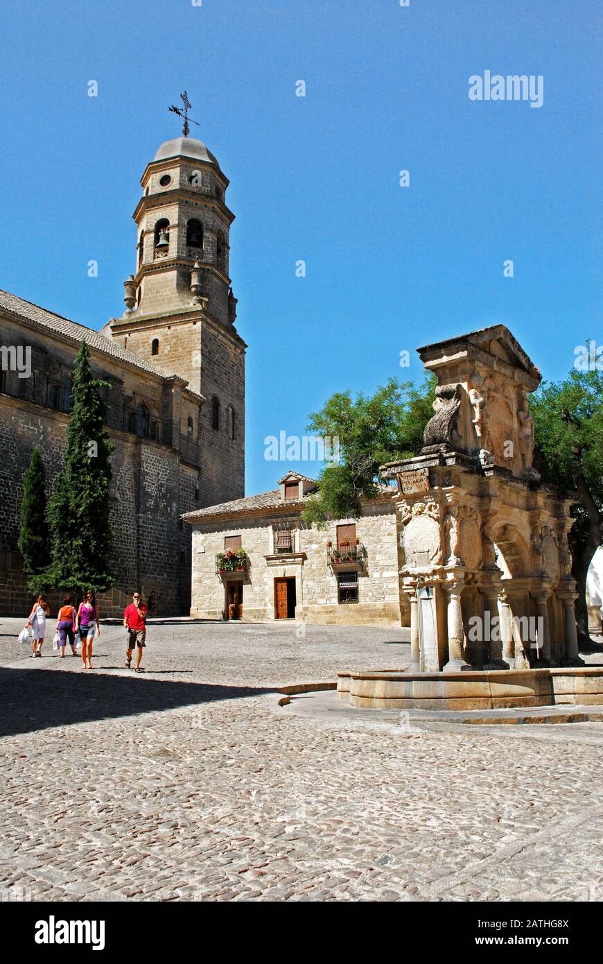 View of the Cathedral with the Santa Maria fountain to the right in the Santa Maria Plaza, Baeza, Jaen Province, Andalucia, Spain. Stock Photo