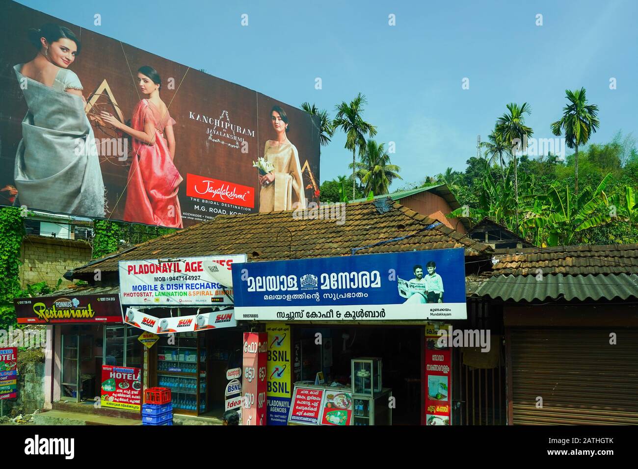 Roadside hoardings advertising jewellery. From a series of travel