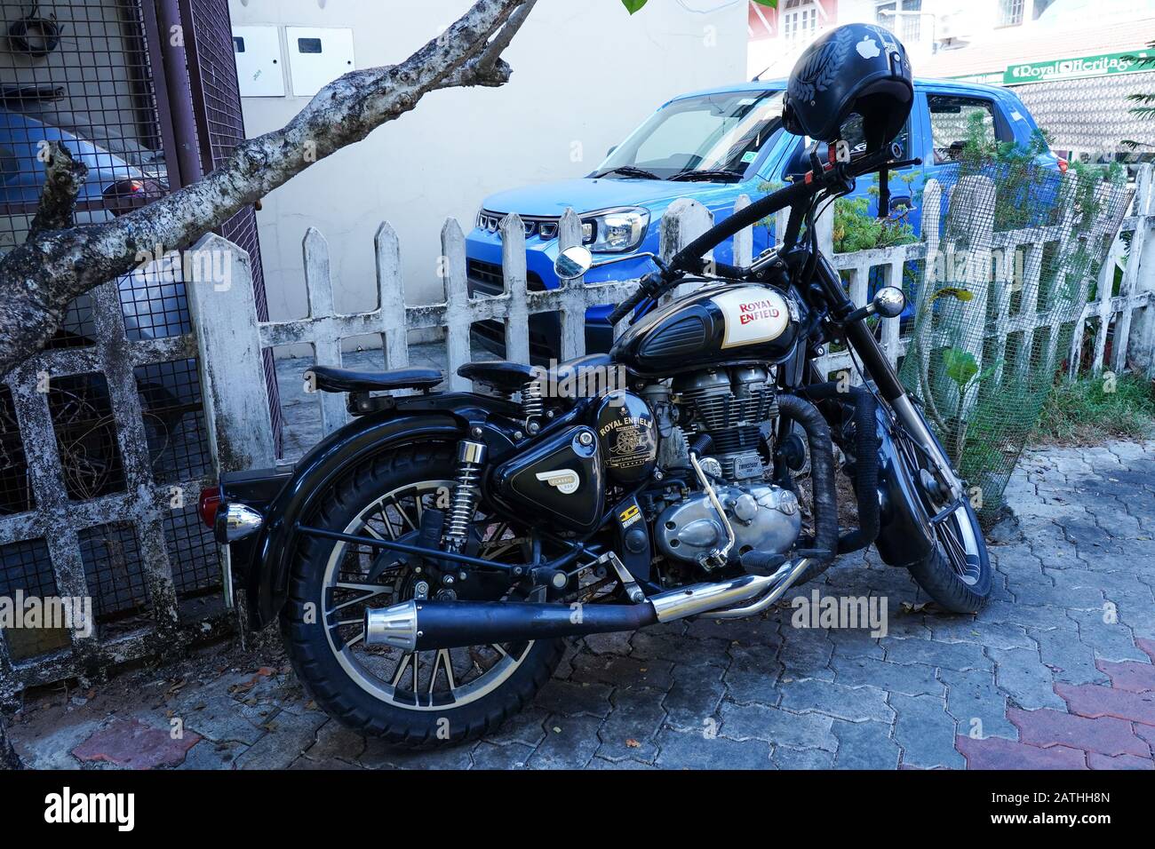 A Royal Enfield motorbike. Views of riders of motorcycles and mopeds in ...