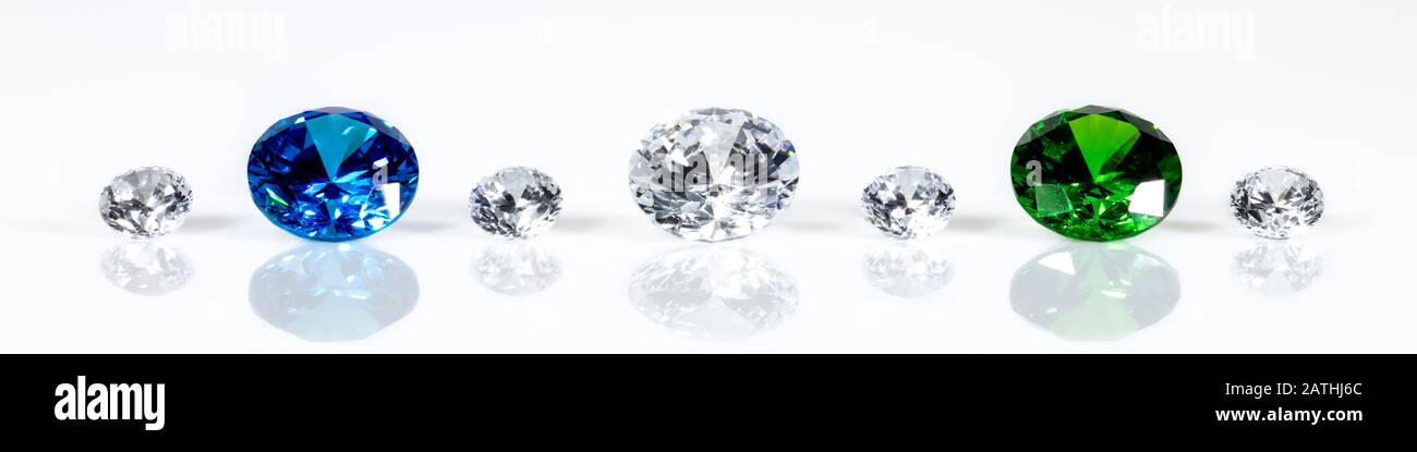 Panorama, flawless brilliant cut jewels, diamonds, sapphire and emerald, white background Stock Photo