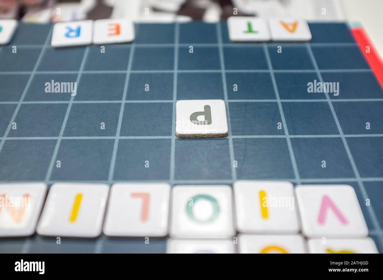 Words formation board game. The game is made with magnetic letter pieces. Selective focus Stock Photo