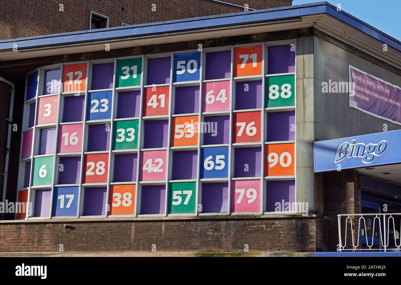 Numbers in coloured panels on side of bingo venue Stock Photo - Alamy