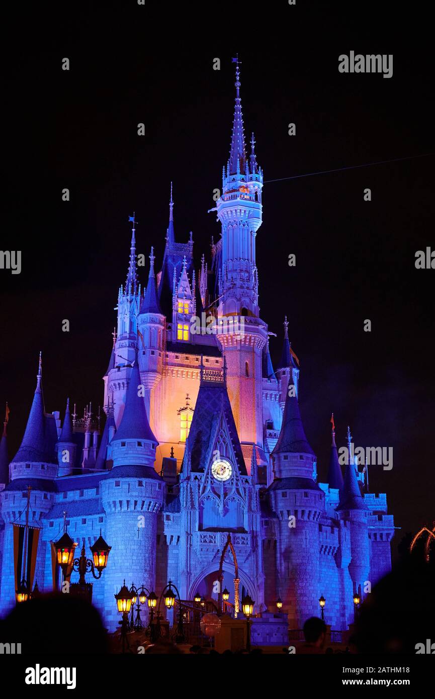 Orlando, USA - january 19, 2020: Blue magic kingdom castle at night time in park Stock Photo