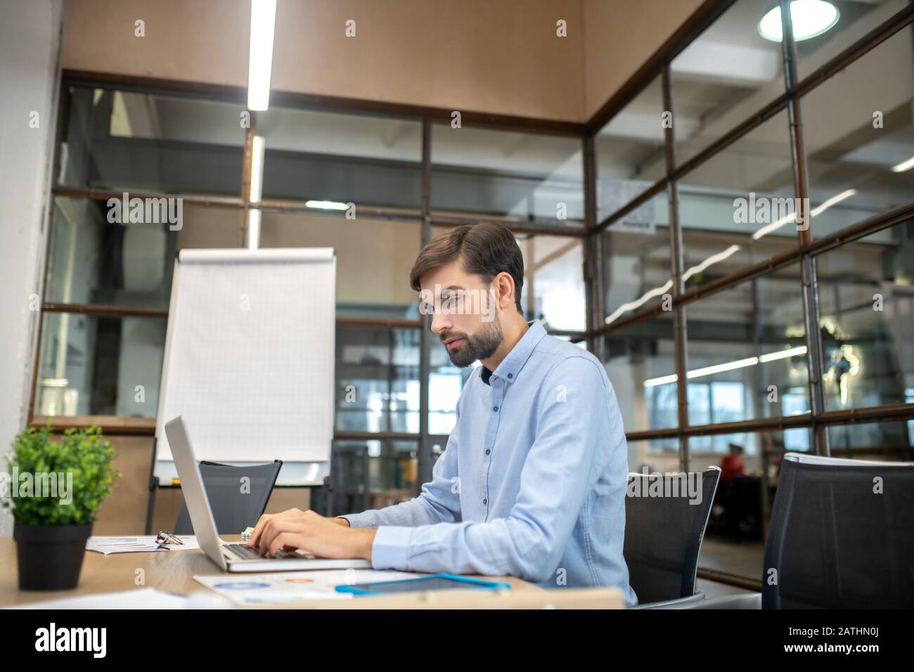 Concentrated bearded man typing hi-res stock photography and images - Alamy