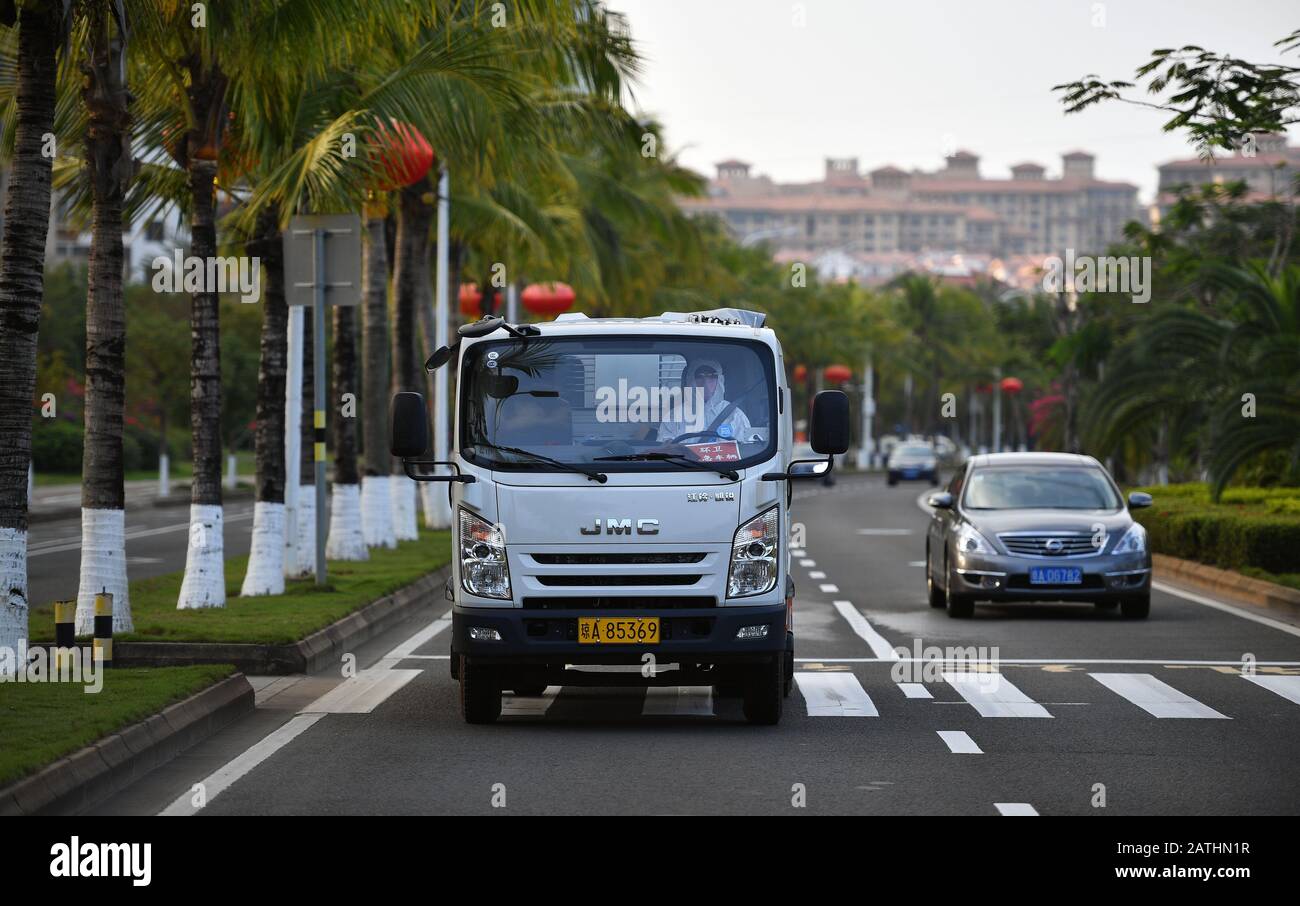 Haikou, China's Hainan Province. 2nd Feb, 2020. Chen Zhiyong drives a truck in Haikou, south China's Hainan Province, Feb. 2, 2020. Chen is a sanitation worker in Haikou. After the outbreak of the novel coronavirus, he had taken the duty of transporting waste facial masks and garbages of a medical observation center. His work unit booked a hotel room for him and covered his meals. Amid the epidemic, Chen is the only customer of that hotel. Credit: Guo Cheng/Xinhua/Alamy Live News Stock Photo