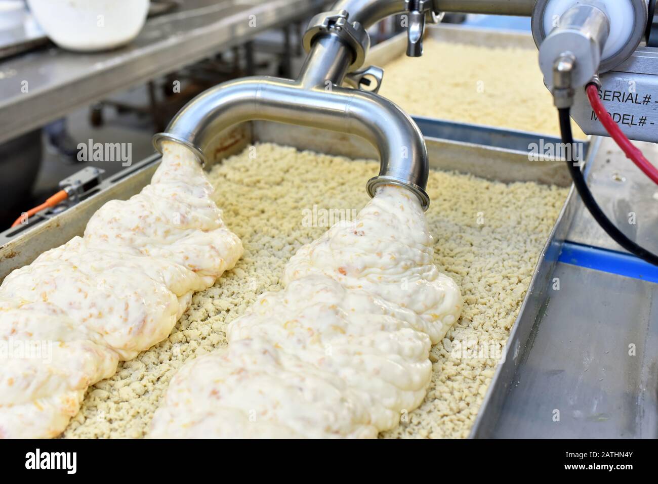 industrial production of cakes and tarts in a large bakery on an assembly line Stock Photo