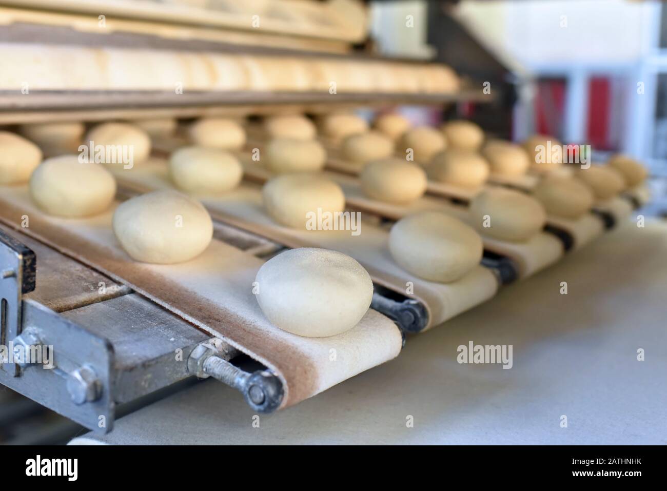 industrial production of bakery products on an assembly line - technology and machinery in the food factory Stock Photo