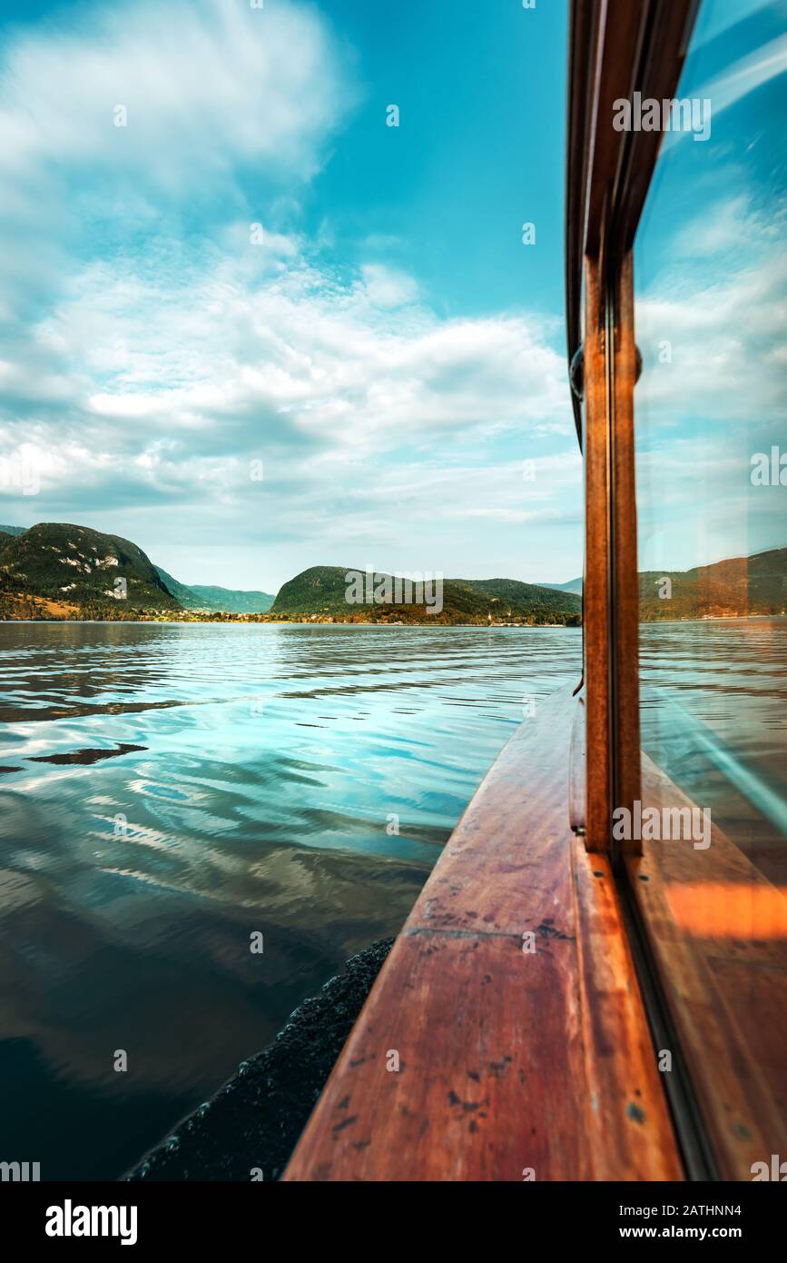 Sailing on Lake Bohinj in summer, famous travel destination in Slovenia national park Triglav seen from electric boat Stock Photo