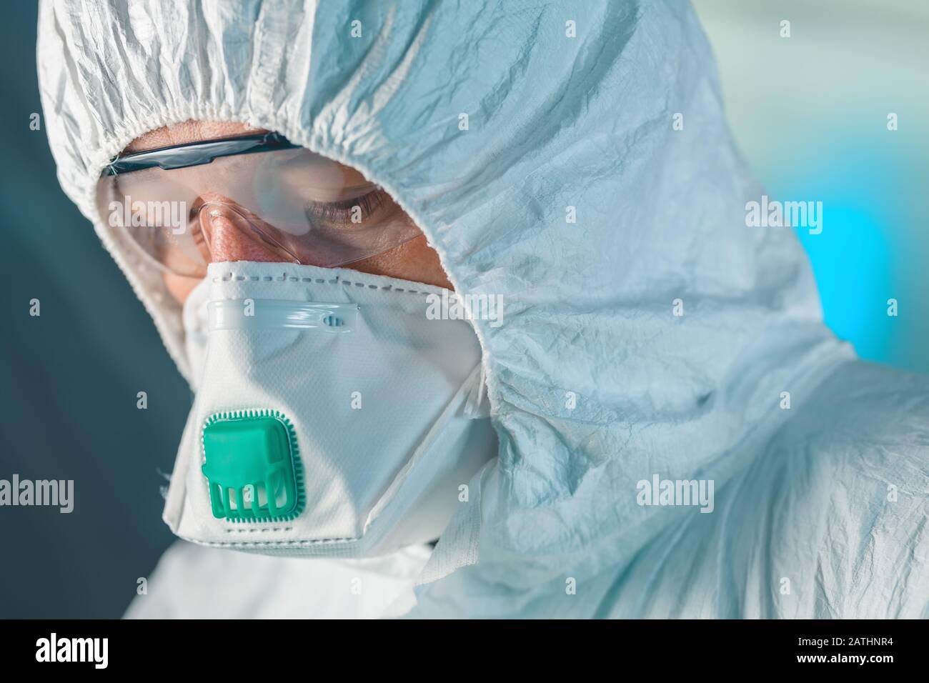 Worried concerned epidemiology specialist, close up portrait head shot of epidemiologist in protective clothing Stock Photo