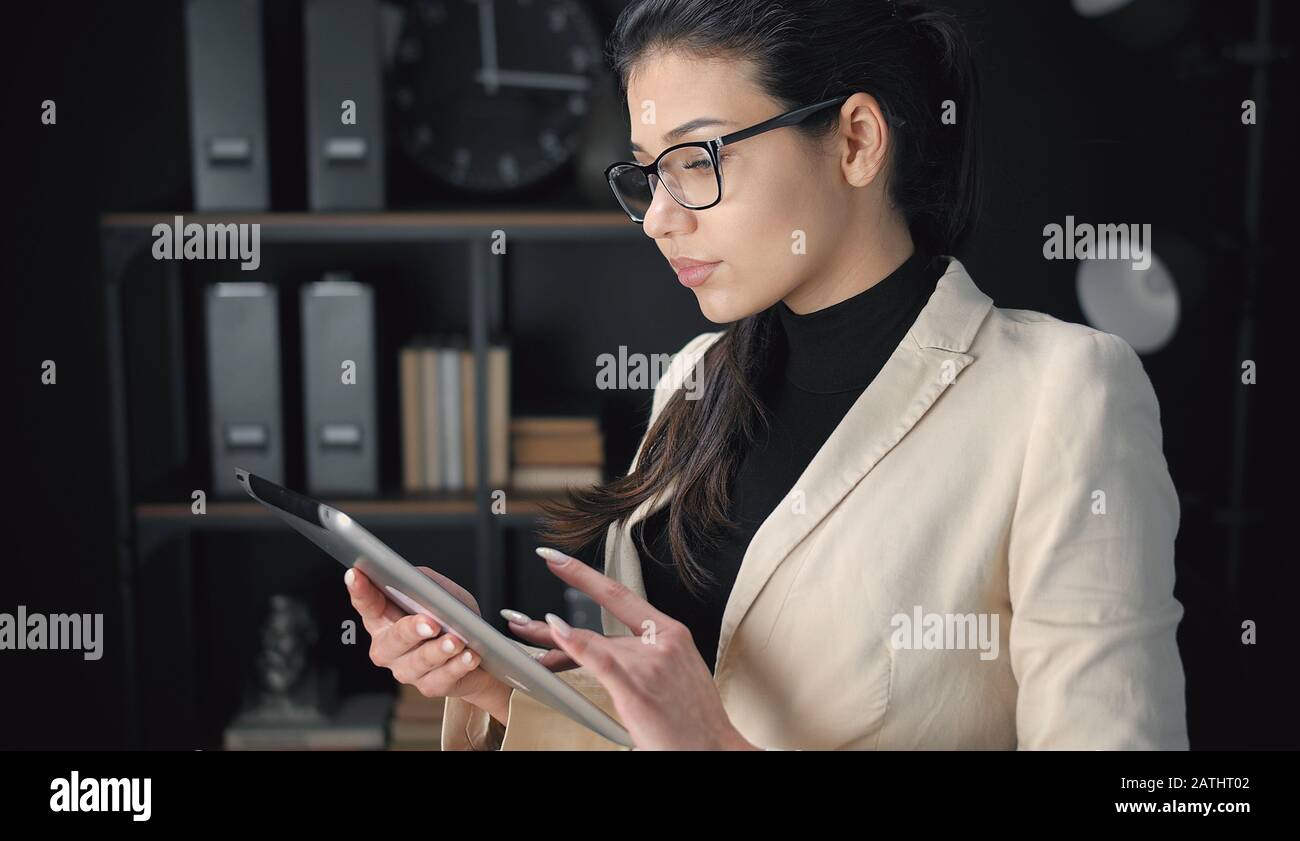 Businesswoman using electronic tab Stock Photo