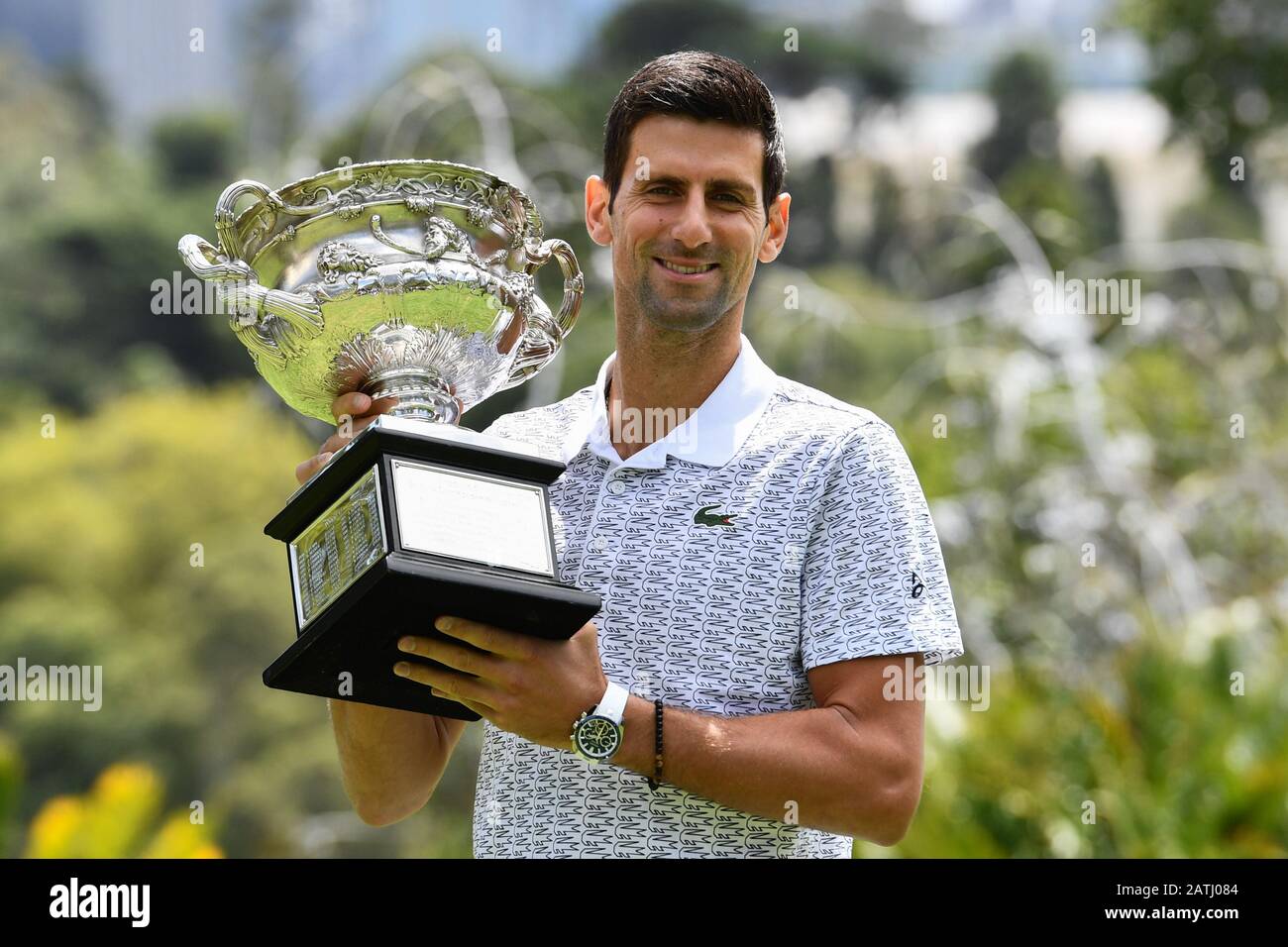 Melbourne, Australia. 3rd Feb, 2020. Australian Open men's singles champion  Novak Djokovic of Serbia poses for photographs with the winner's trophy at  Royal Botanic Gardens Victoria in Melbourne, Australia on Feb. 3,