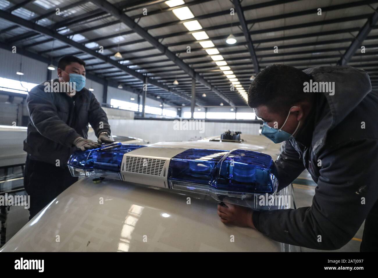 (200203) -- SHENYANG, Feb. 3, 2020 (Xinhua) -- Workers produce ambulance at the manufacturing base of the Brilliance Auto company in Shenyang, northeast China's Liaoning Province, Feb. 3, 2020. In recent days, the company has rushed to produce negative pressure ambulances for the fight against the novel coronavirus epidemic. The production of the first batch of 10 negative pressure ambulances will be completed on Feb. 5 and then put into use. (Xinhua/Pan Yulong) Stock Photo