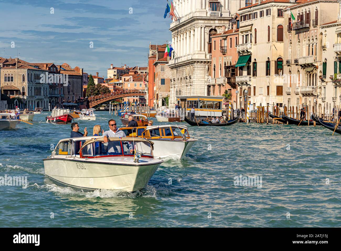 Water taxi's taking passengers to their destinations along the The Grand Canal ,Venice,Italy Stock Photo