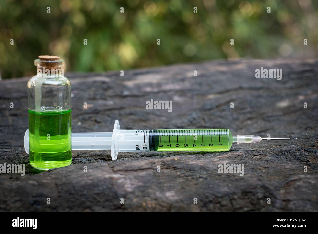 Syringe there is medicine inside on table old wood Stock Photo