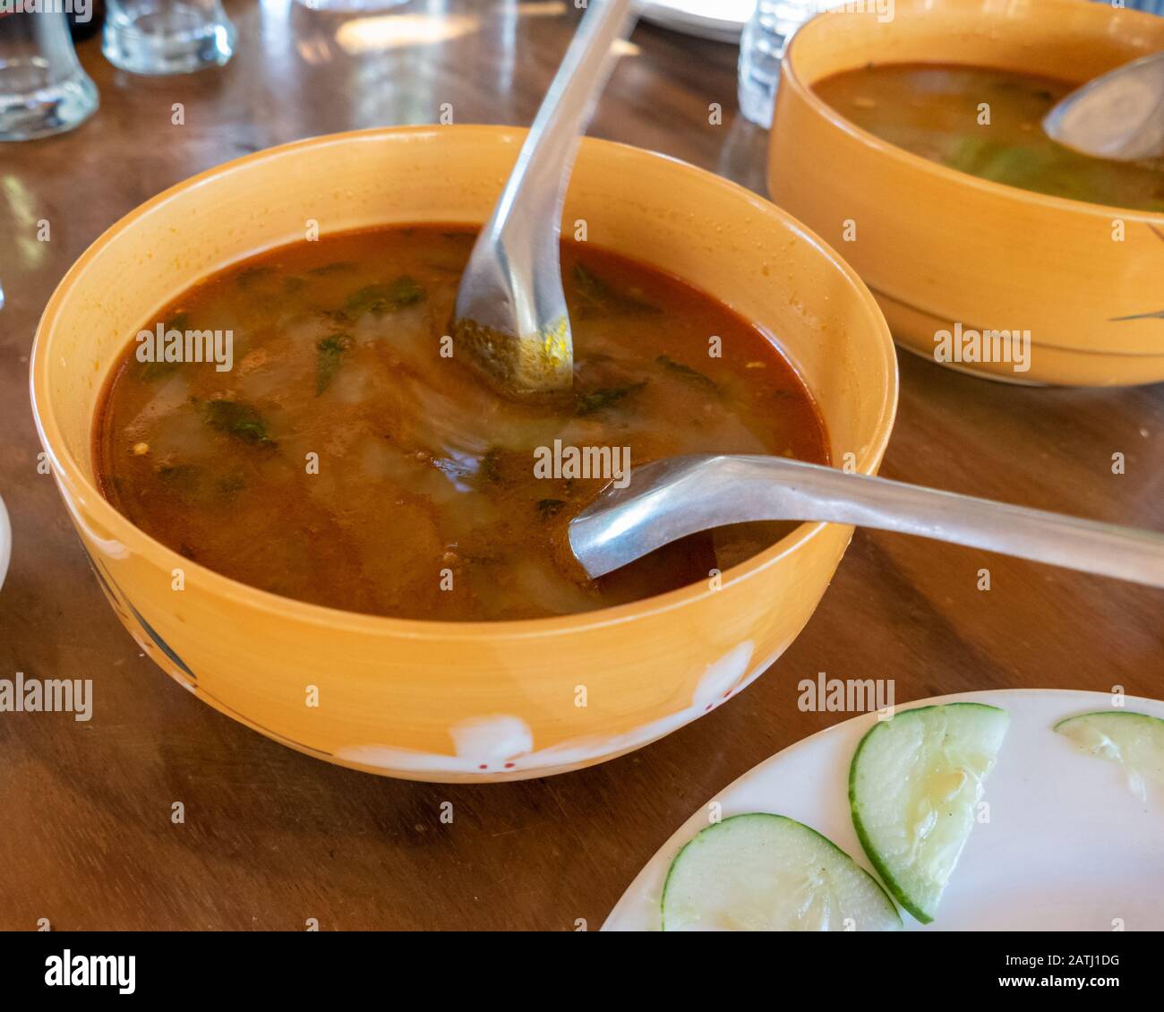 Selection of burmese dishes in rural Myanmar with skinny chicken and traditional soup Stock Photo