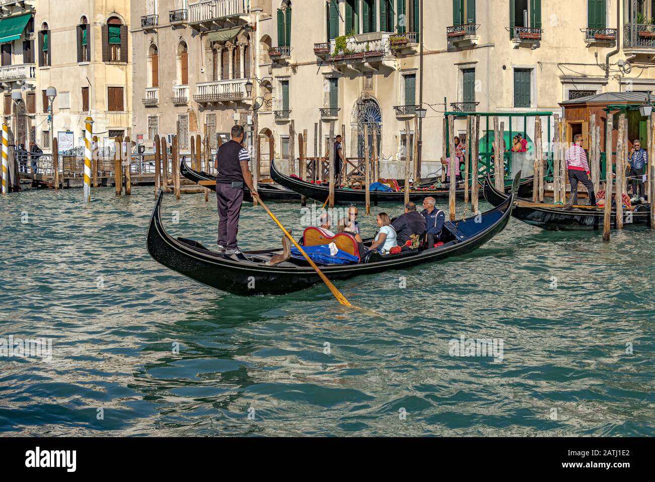 Torists taking a gondola ride on The Grand Canal ,Venice ,Italy Stock Photo