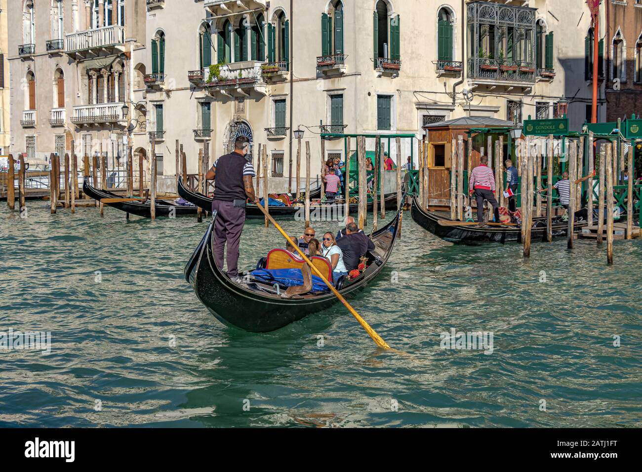 Torists taking a gondola ride on The Grand Canal ,Venice ,Italy Stock Photo