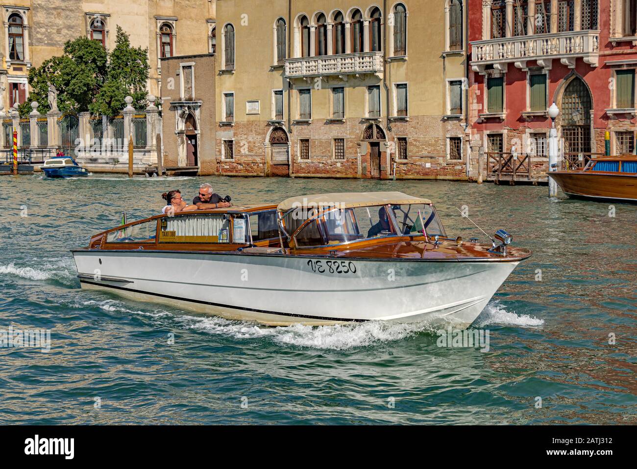 A Venice Water taxi cruising along the  The Grand Canal ,Venice,Italy Stock Photo