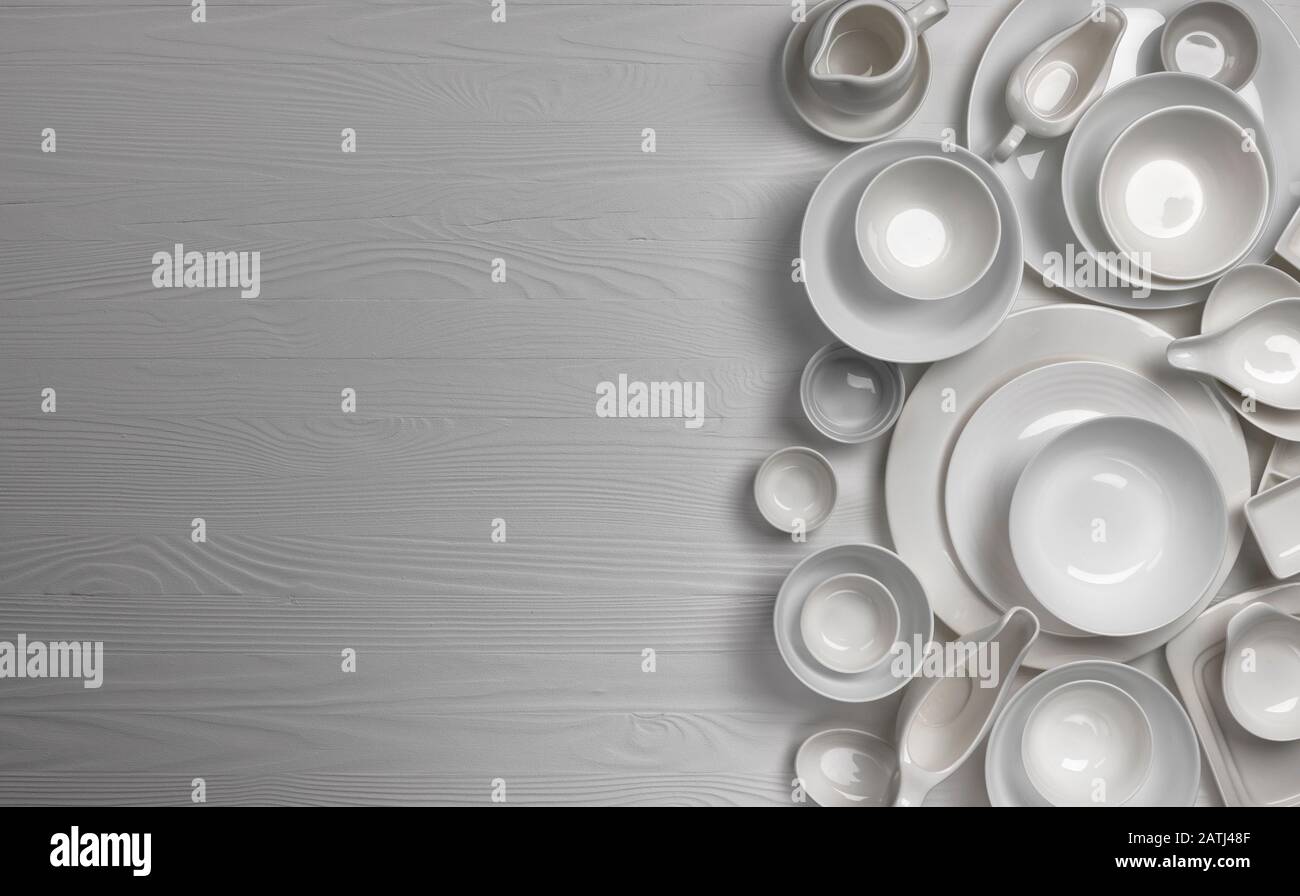 Set of empty dishware on white background with copy space Stock Photo