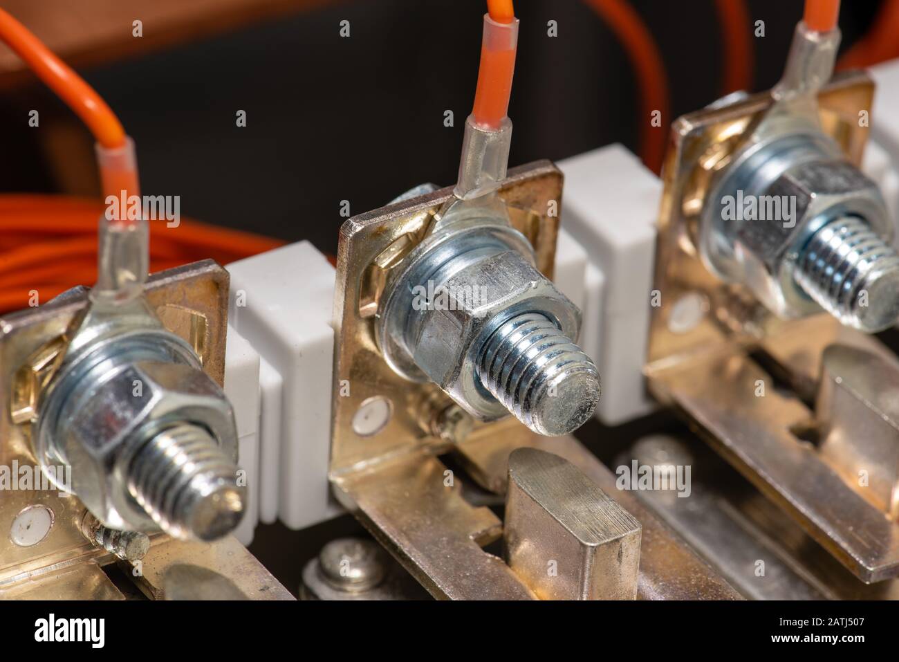 Joint with bolts and nuts in electrical switchboard closeup Stock