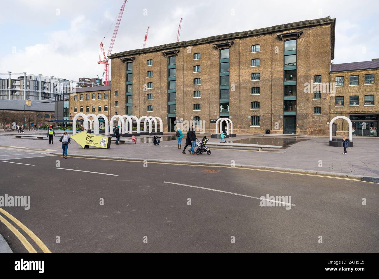 People out and about in Coal Drops Yard on a wintry Saturday morning in February. Kings Cross, London, UK Stock Photo