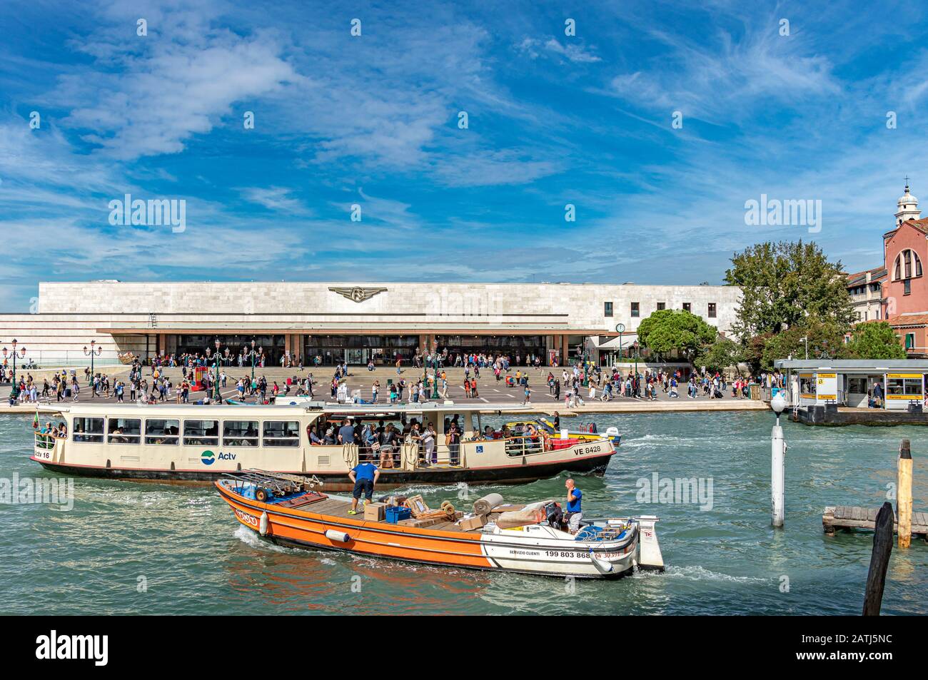 A Vaporetto And A Boat Carrying Supplies Passing In Front Of Santa a-vaporetto-and-a-boat-carrying-supplies-passing-in-front-of-santa