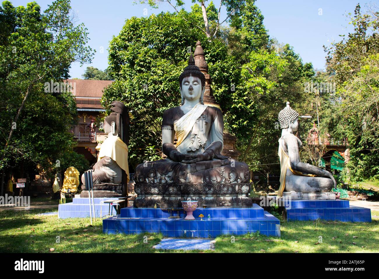 SARABURI, THAILAND - NOVEMBER 26 : Three buddha statue in pagoda for thai people and foreign travelers visit and respect praying at Wat Pa Sawang Bun Stock Photo