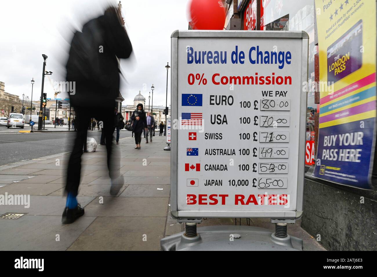 London, UK.  3 February 2020.  People pass by signs outside a foreign currency exchange near Trafalgar Square.  Boris Johnson, Prime Minister, has given a speech in Greenwich calling for a Canada-style free trade deal between the UK and European Union.  In the EU-Canada deal import tariffs on most goods have been eliminated between the two countries, but some customs and VAT checks still exist.  Currency markets have seen a fall in sterling in reaction to the speech.  Credit: Stephen Chung / Alamy Live News Stock Photo