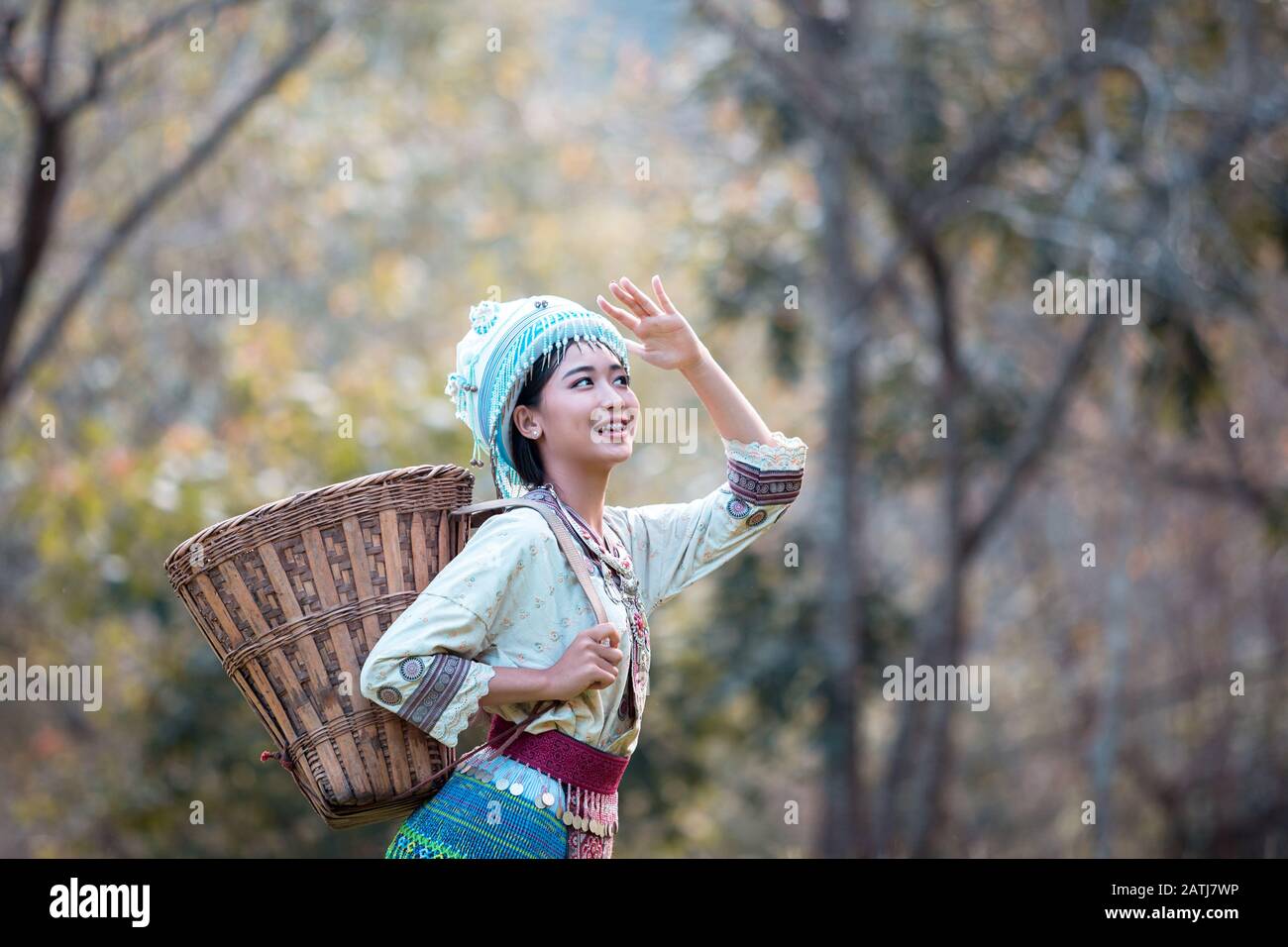 Young woman wearing Hmong traditional dress and enjoying the coffee garden at Doi Pui Chiang Mai Thailand. Stock Photo