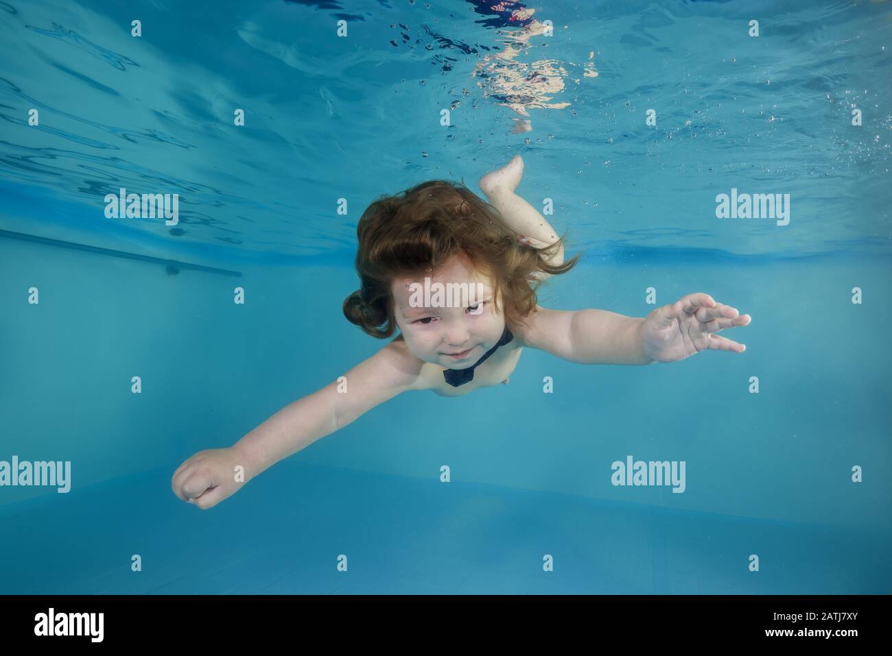 Boy swimming underwater in pool hires stock photography and images Alamy