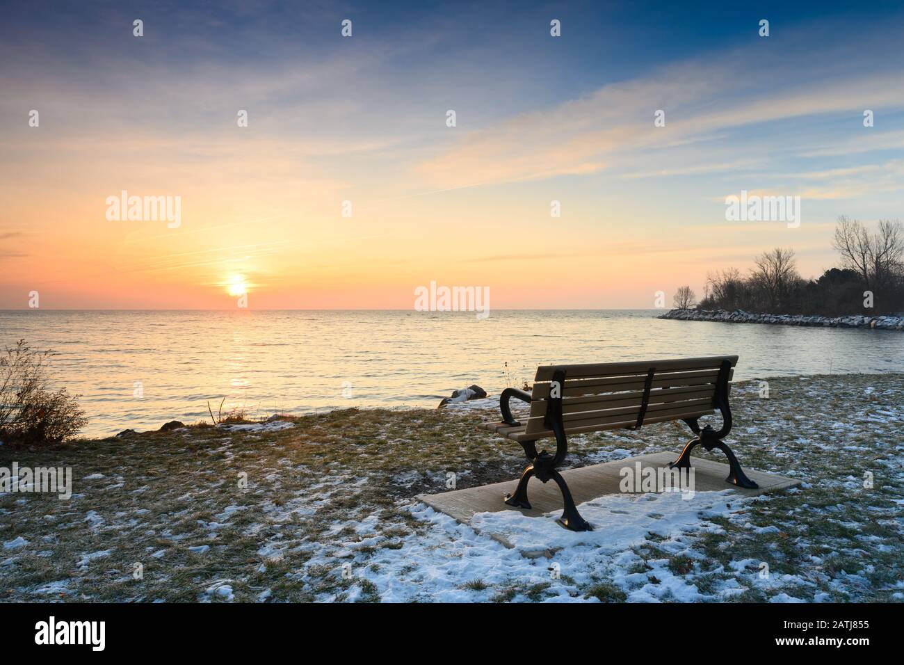 The sun brings light back into the world following the long, dark winter solstice, as seen from Toronto, Ontario's popular Ashbridges Bay Park along t Stock Photo