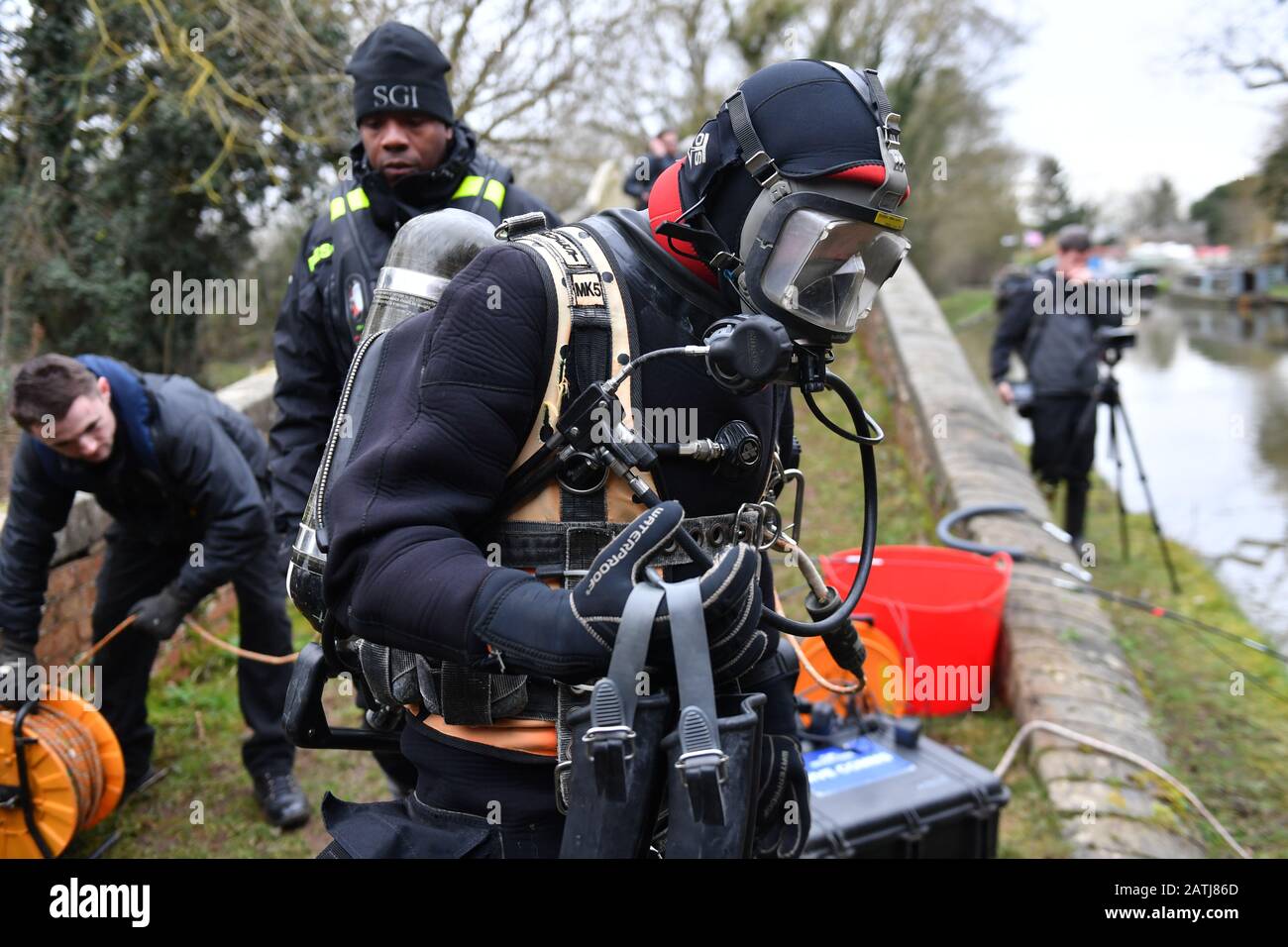 A police diver prepares to enter a canal near Rugby, Warwickshire, after detectives have begun searching the canal in a bid to locate the body of a young mother who disappeared in Coventry almost 30 years ago. Stock Photo