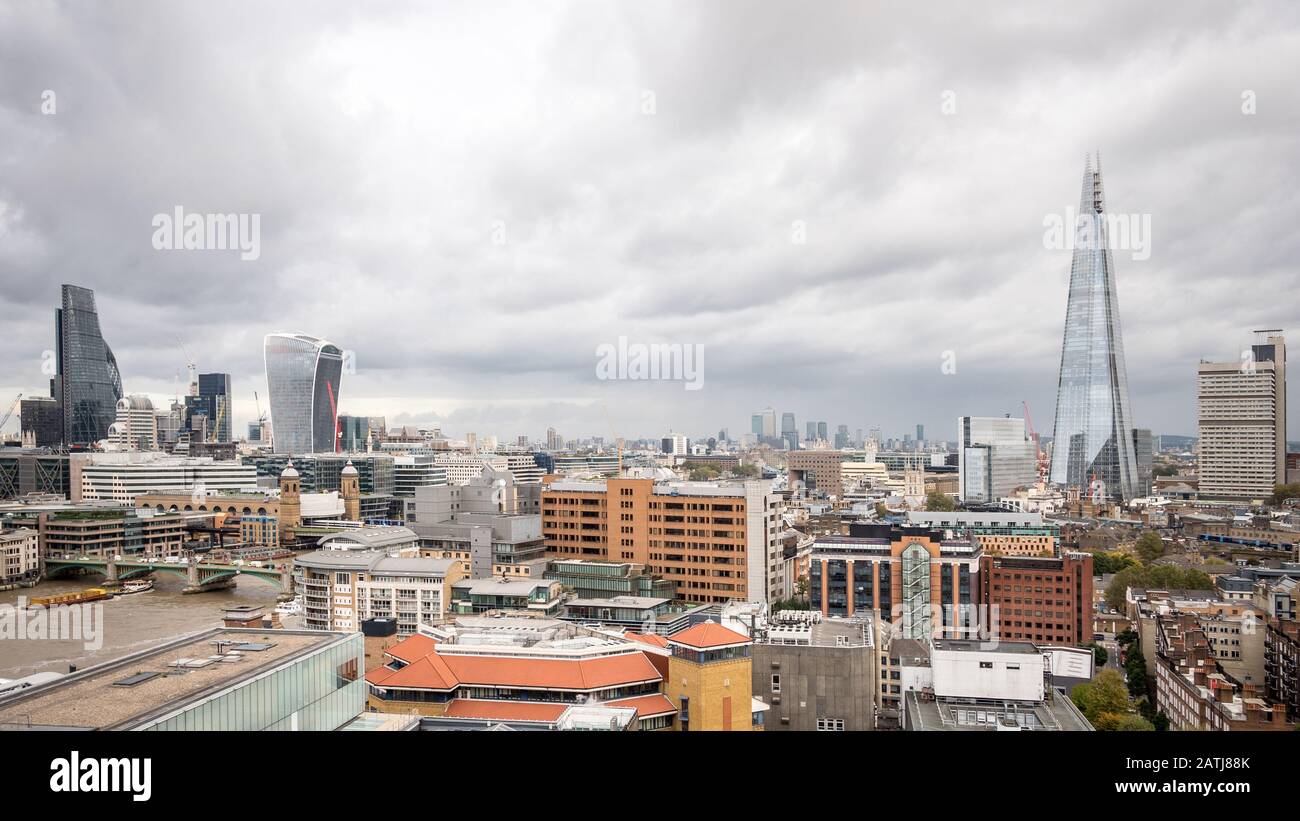 Business London. A view over the  financial districts including the City of London skyscrapers (left), Docklands in the far distance, and The Shard. Stock Photo