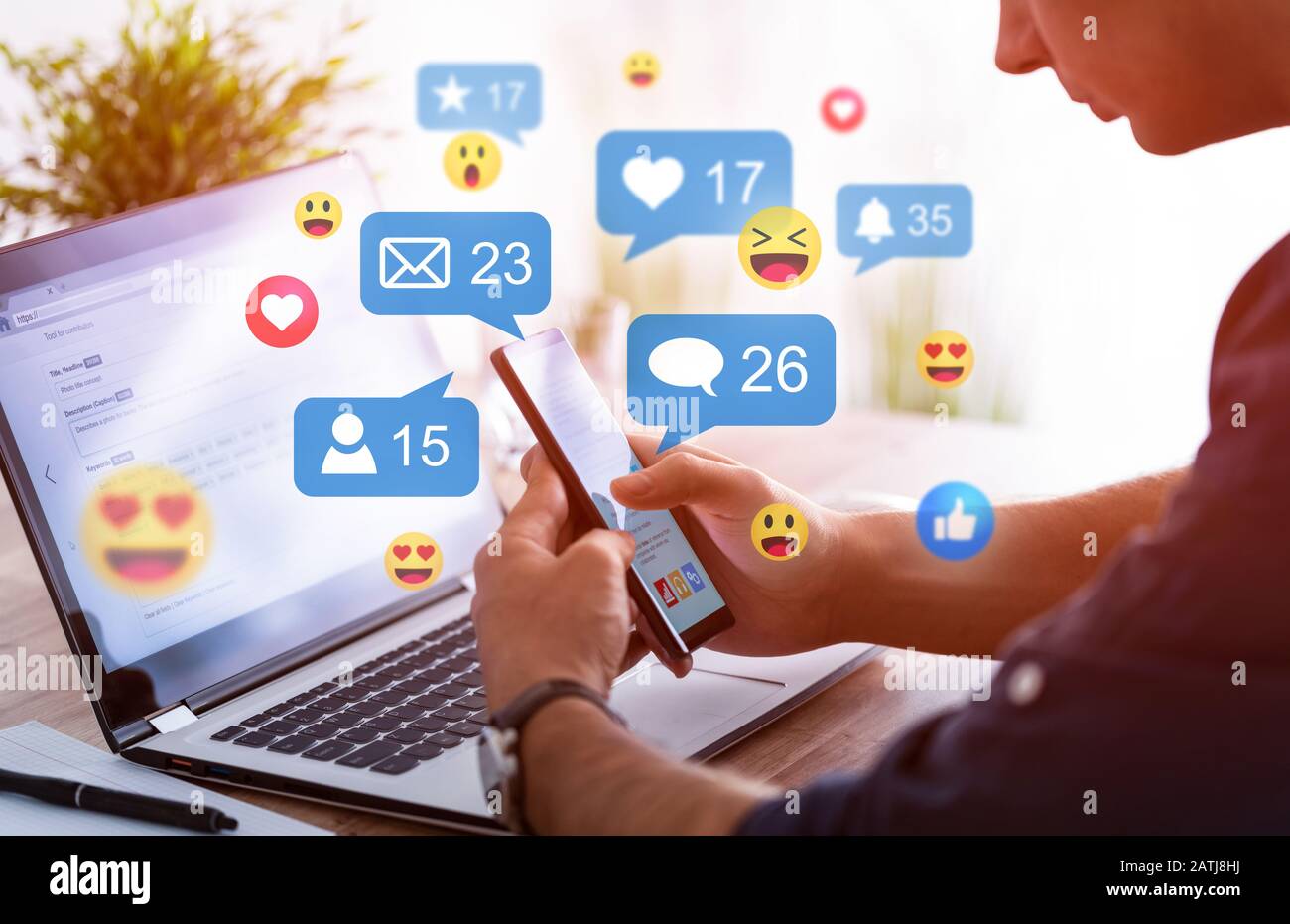 Like and share social media. Hands holding smartphone with social media network icons. Marketing concept. Stock Photo