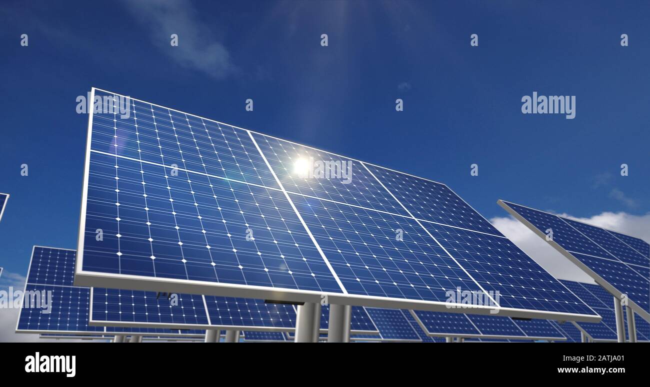 Solar energy panels with sun reflection and blue sky in background
