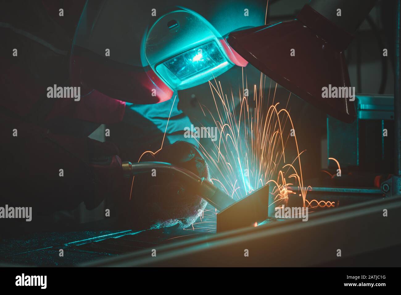 The welding male welder working in the workshop Stock Photo