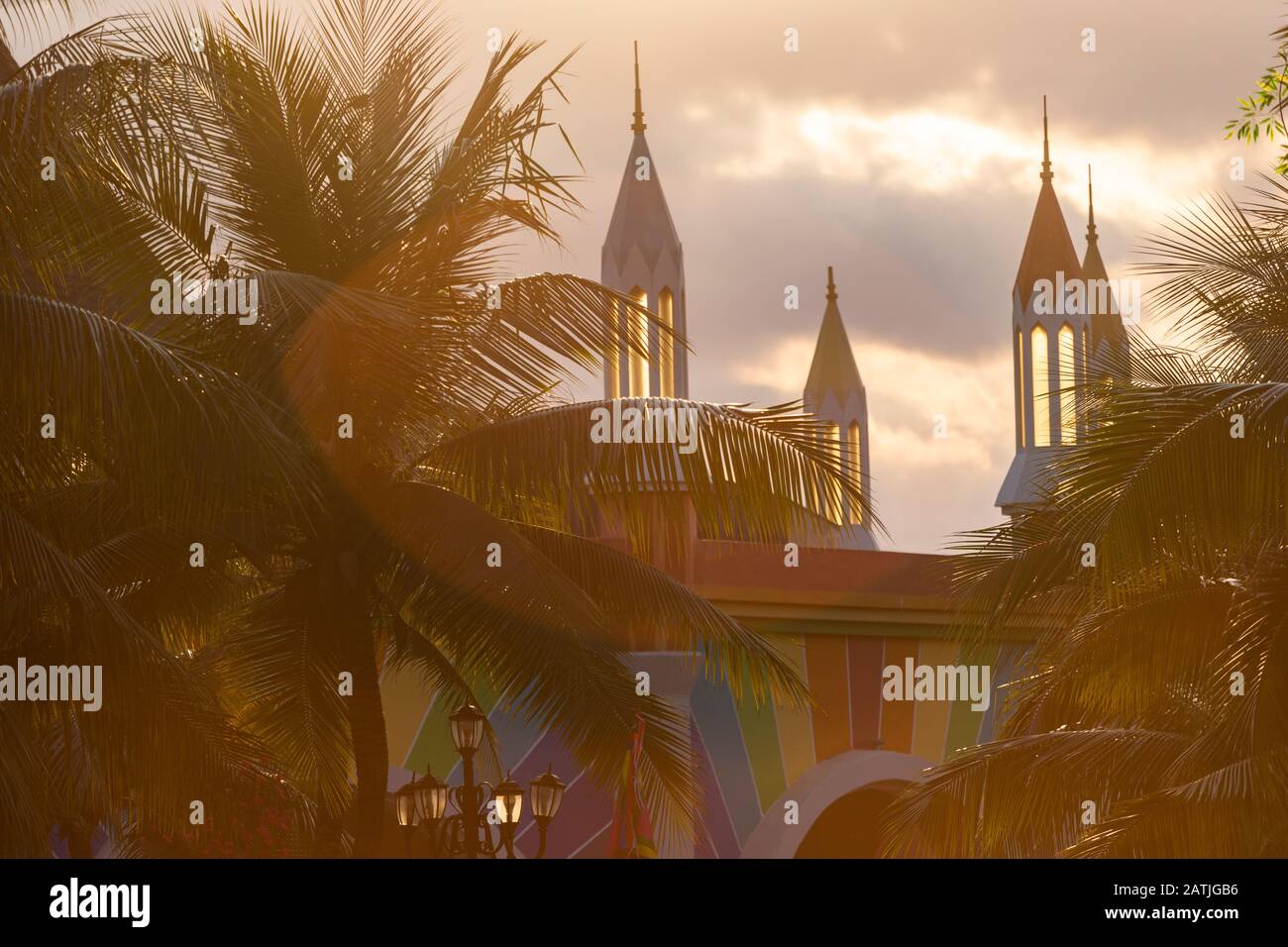 Beautiful gothic castle styled building with towers in late afternoon light at Vinpearl Land at Nha Trang in Vietnam Stock Photo