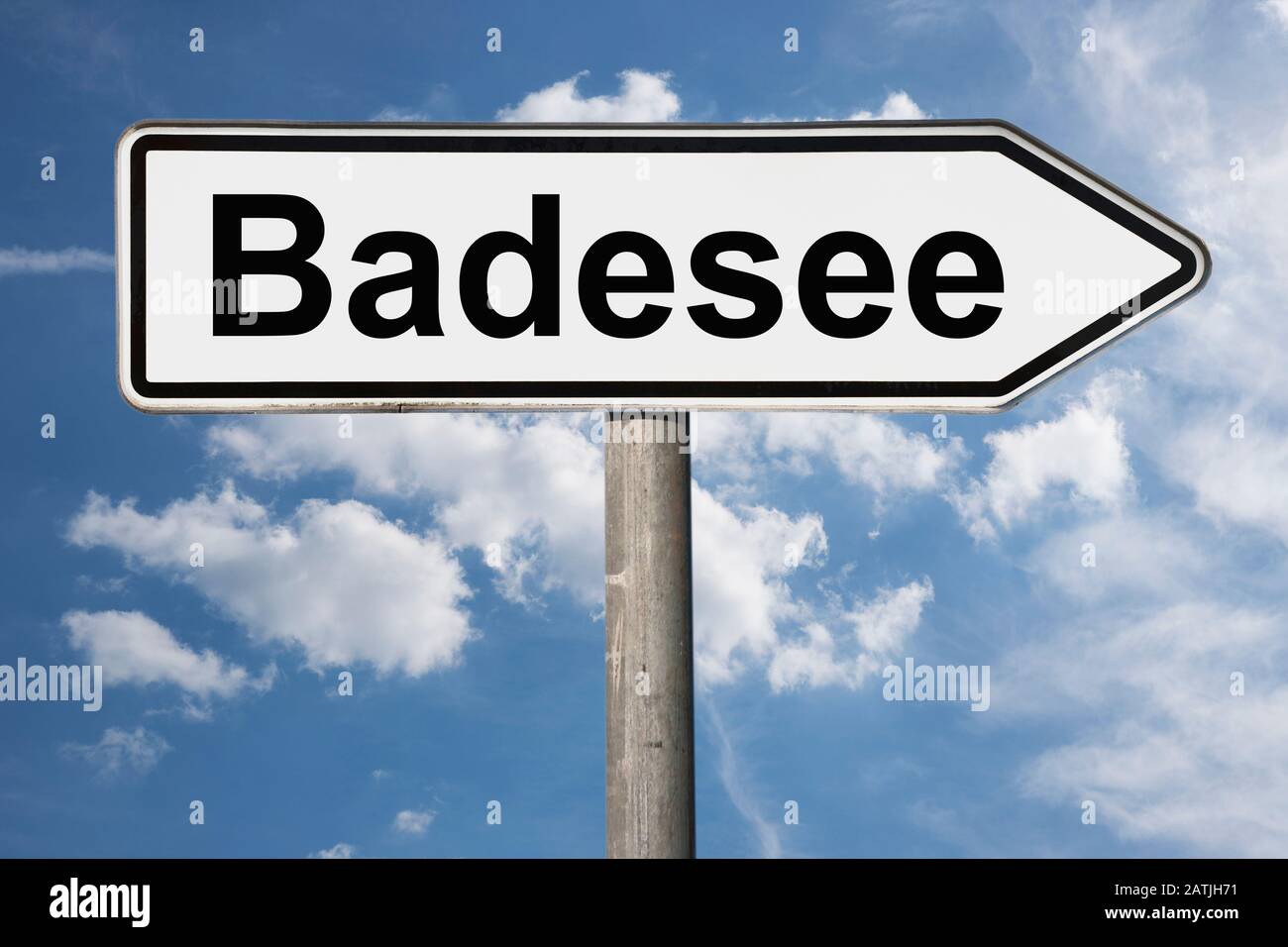 Detail photo of a signpost with the inscription Badesee (Swimming pond) Stock Photo