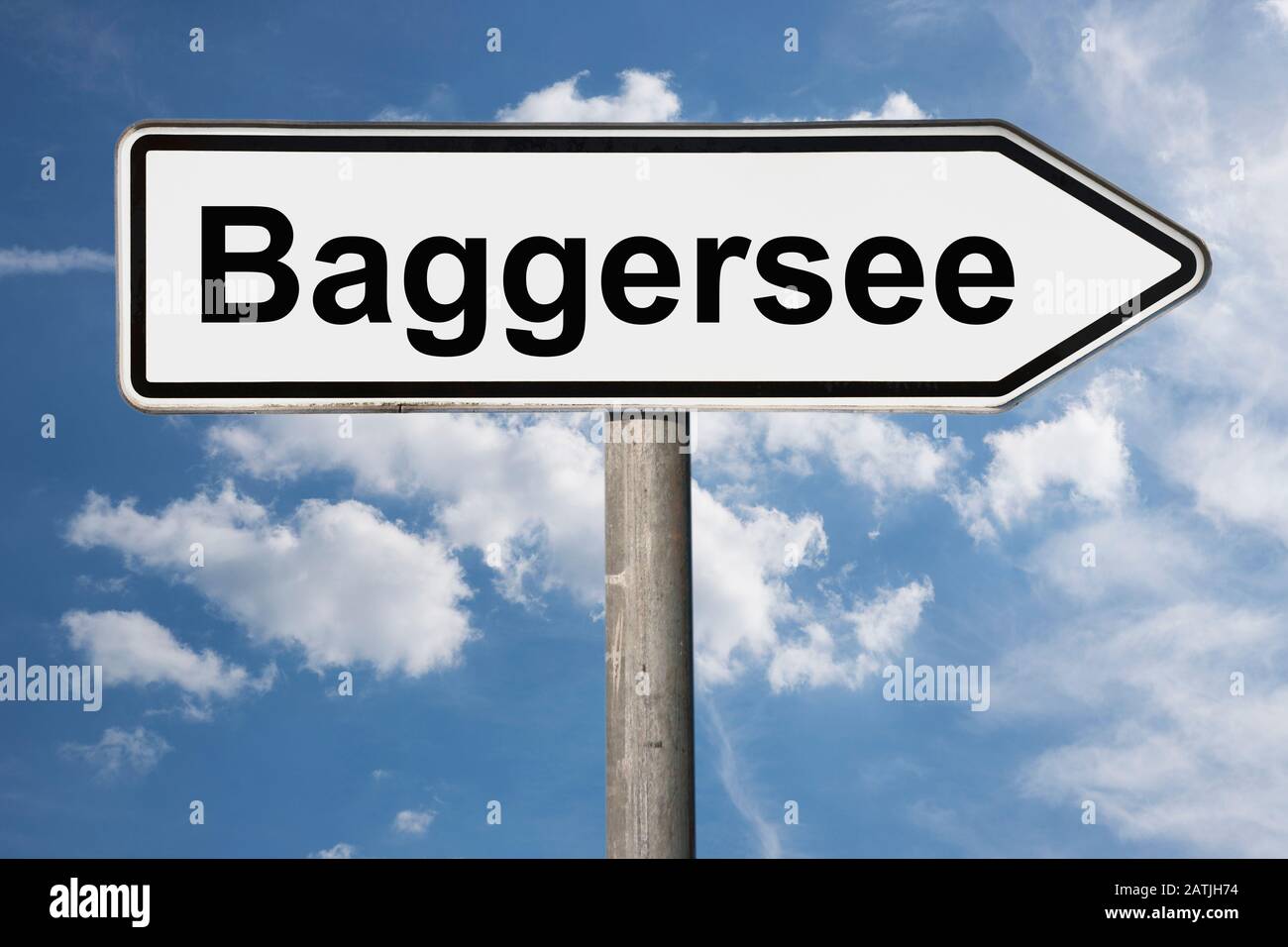 Detail photo of a signpost with the inscription Baggersee (Quarry pond) Stock Photo