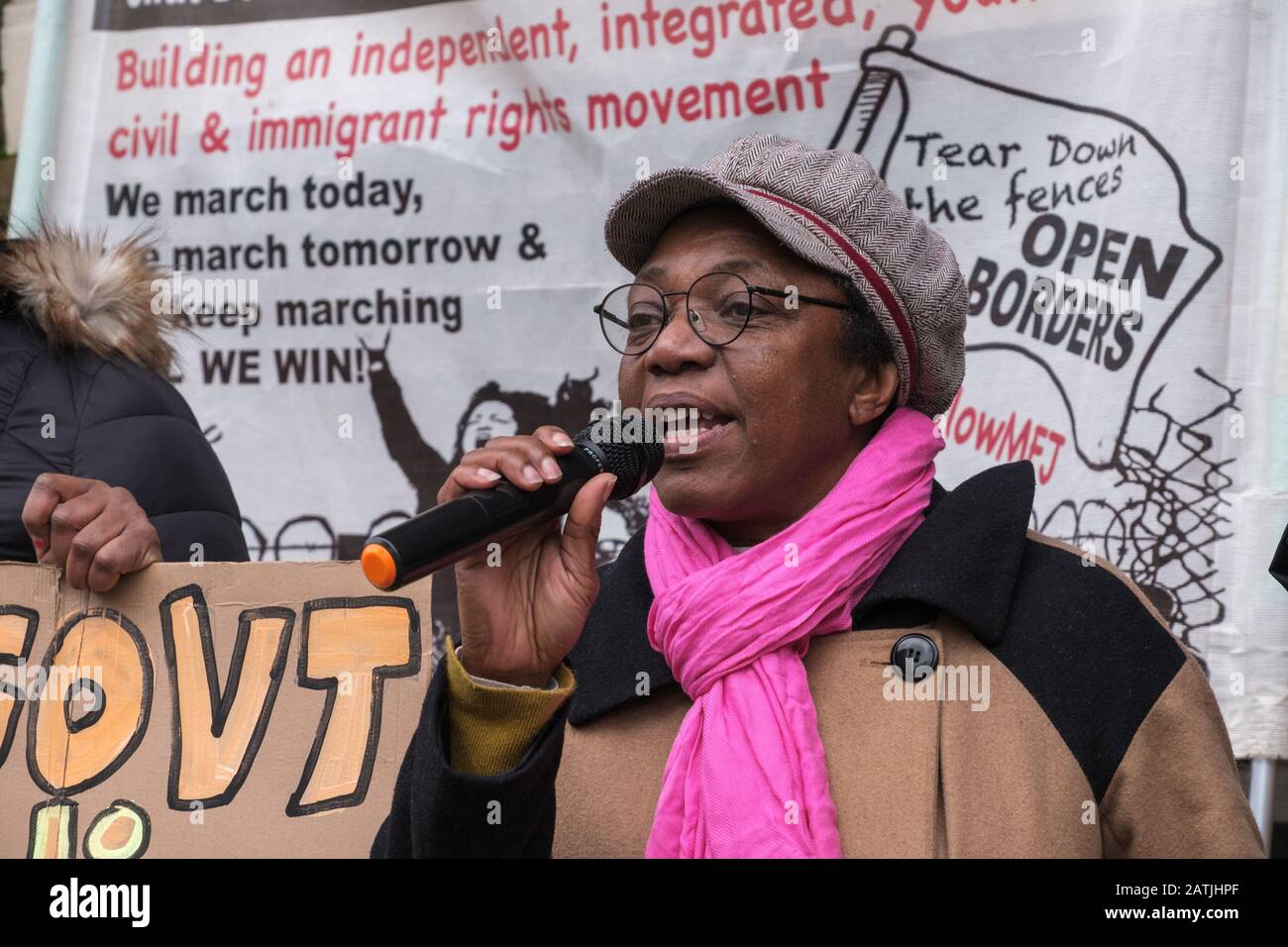 London, UK. 3rd February 2020. A black woman speaks at the Movement for Justice protest outside the Jamaican High Commission demanding Jamaica end accepting Britain's racist deportation flights. They say these are a modern equivalent of slave ships, with deportees manacled between guards for the flight. Those seized include many from Windrush families who have lived here most of their lives but are unable to produce the exhaustive paperwork demanded and seldom have the chance to properly contest their case. Peter Marshall/Alamy Live News Stock Photo
