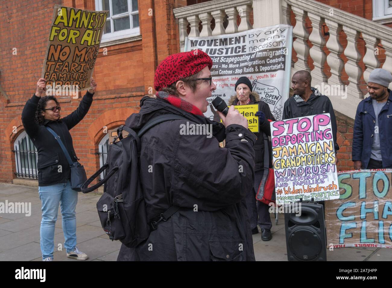 London, UK. 3rd February 2020. Karen Doyle of Movement for Justice speaks at a protest outside the Jamaican High Commission demanding Jamaica end accepting Britain's racist deportation flights. They say these are a modern equivalent of slave ships, with deportees manacled between guards for the flight. Those seized include many from Windrush families who have lived here most of their lives but are unable to produce the exhaustive paperwork demanded and seldom have the chance to properly contest their case. Peter Marshall/Alamy Live News Stock Photo