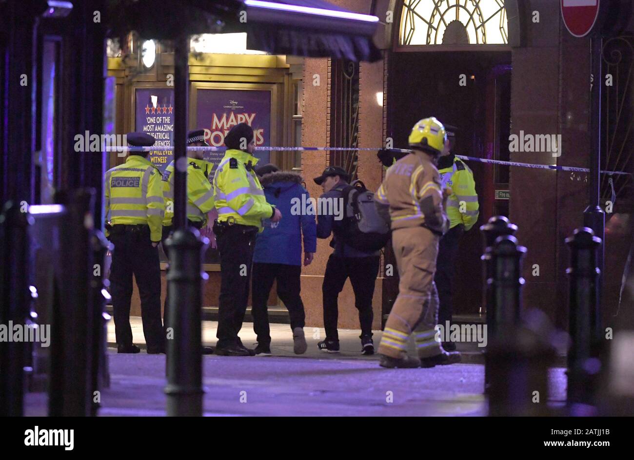 Police and firefighters evacuate members of the public after a World ...