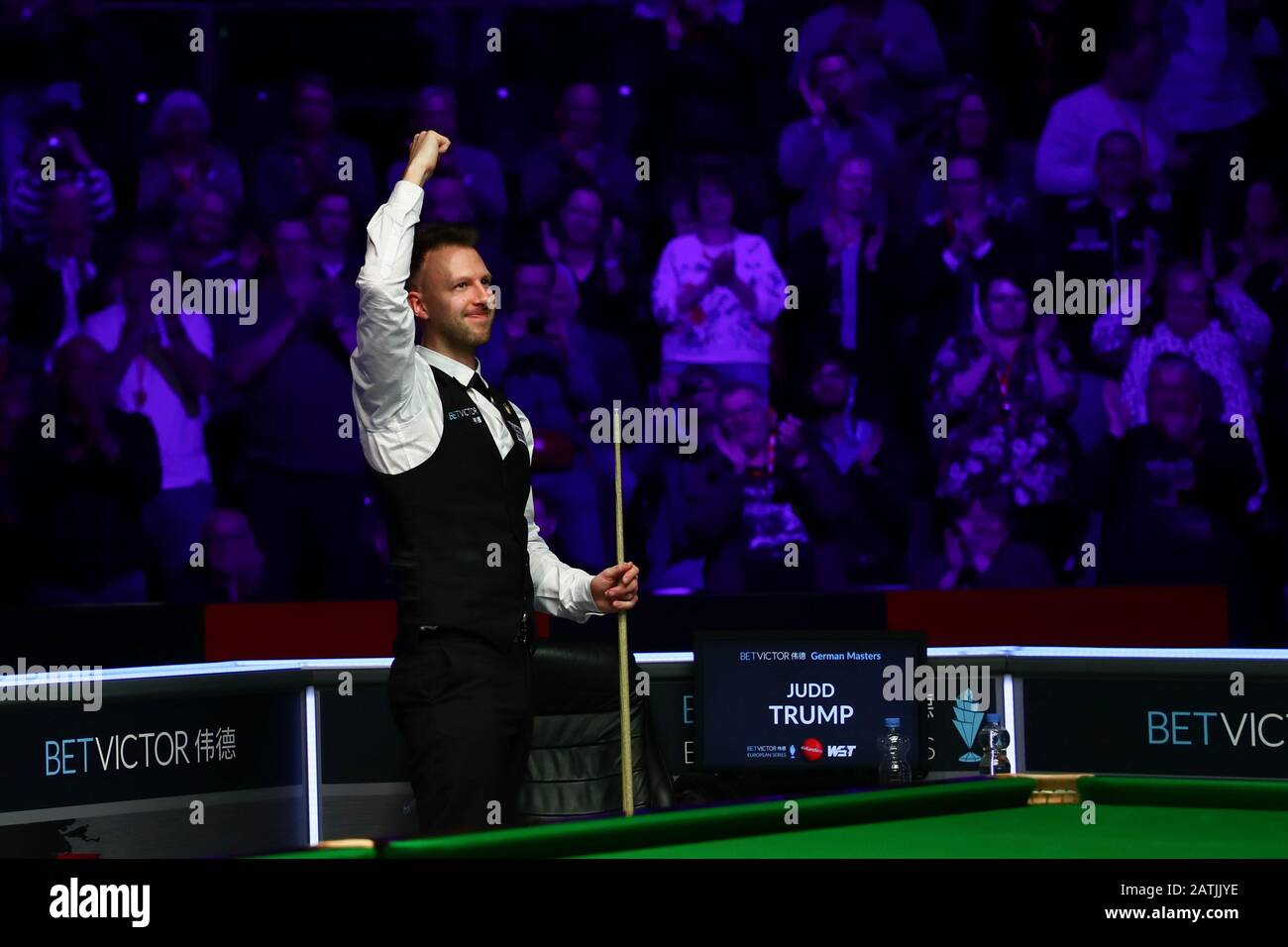 Judd Trump of England celebrates after defeating Neil Robertson of Australia, right, at the final of 2020 German Masters in Berlin, Germany, 2 February 2020