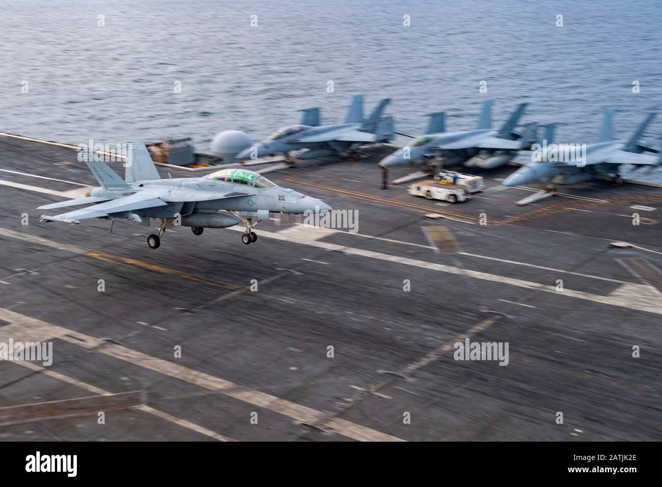 A U.S. Navy F/A-18F Super Hornet fighter aircraft attached to Strike Fighter Squadron 211, lands on the flight deck of the aircraft carrier USS Harry S. Truman following a routine patrol December 29, 2019 in the Arabian Sea. Stock Photo
